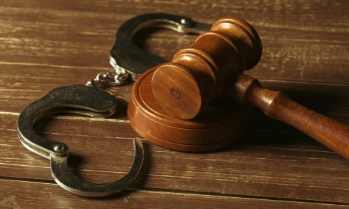 Close-up view of brown wooden mallet of judge
